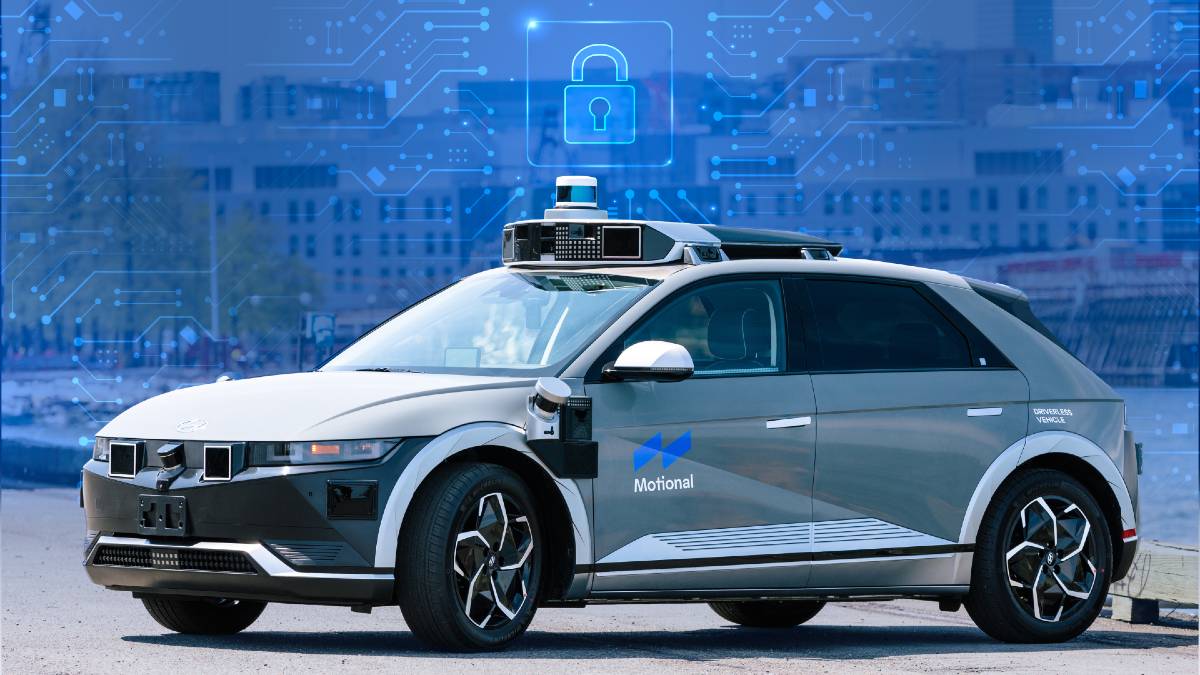The Motional IONIQ 5 robotaxi in front of a blue cybersecurity background