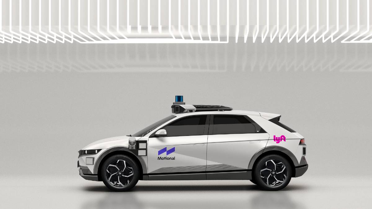The Motional IONIQ 5 robotaxi seen in a bright, white garage space