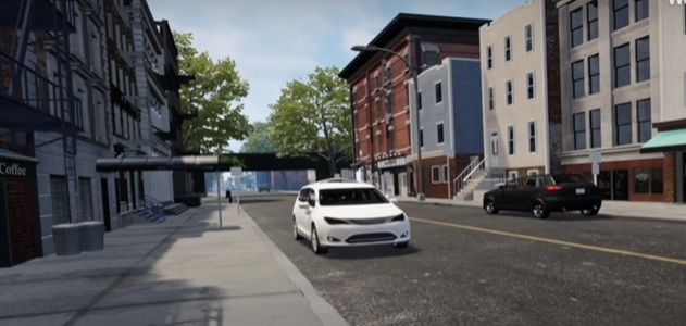 A white vehicle comes to a stop during a virtual reality test