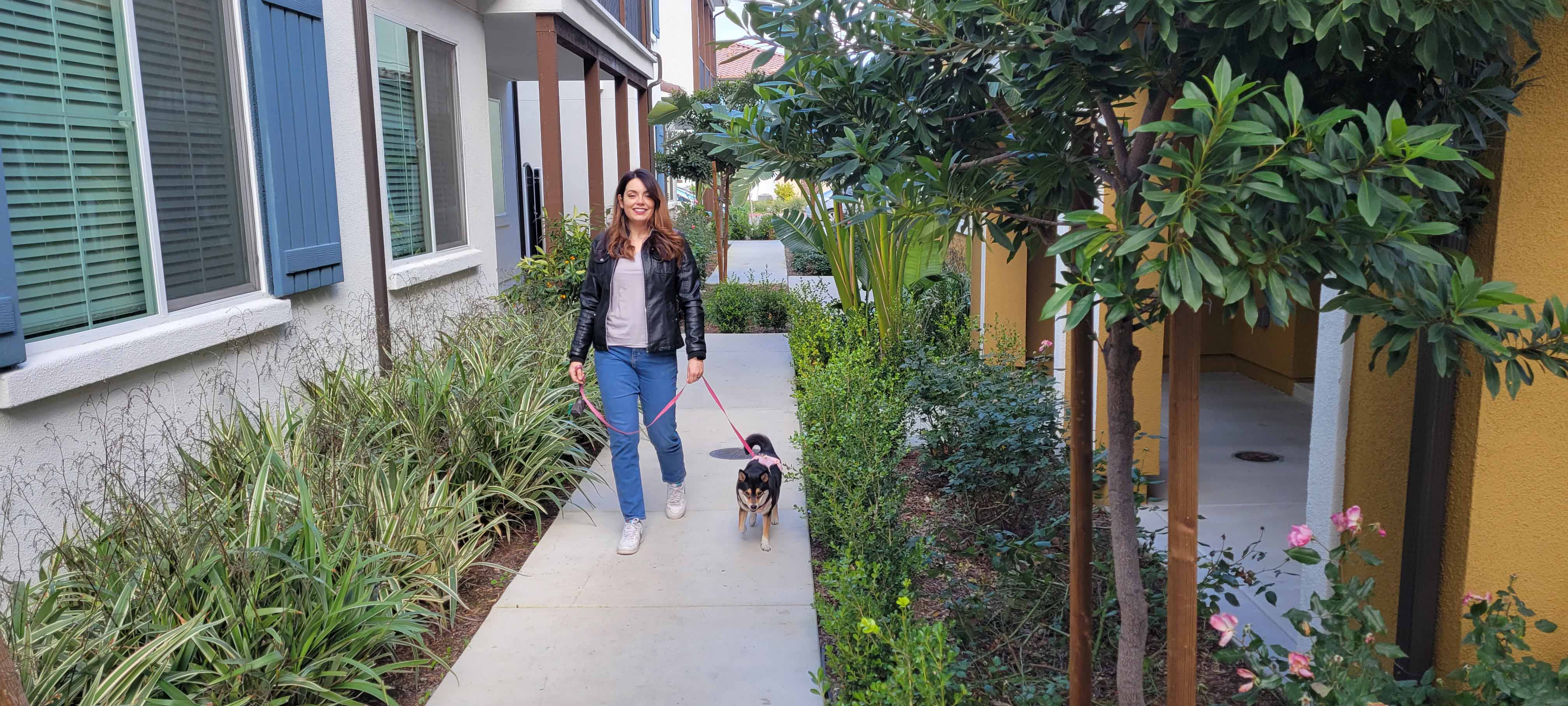 Liliana Salinas walks her dog