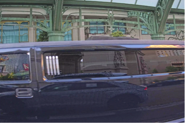 A camera shot from a Motional robotaxi of the center of a black stretch limo