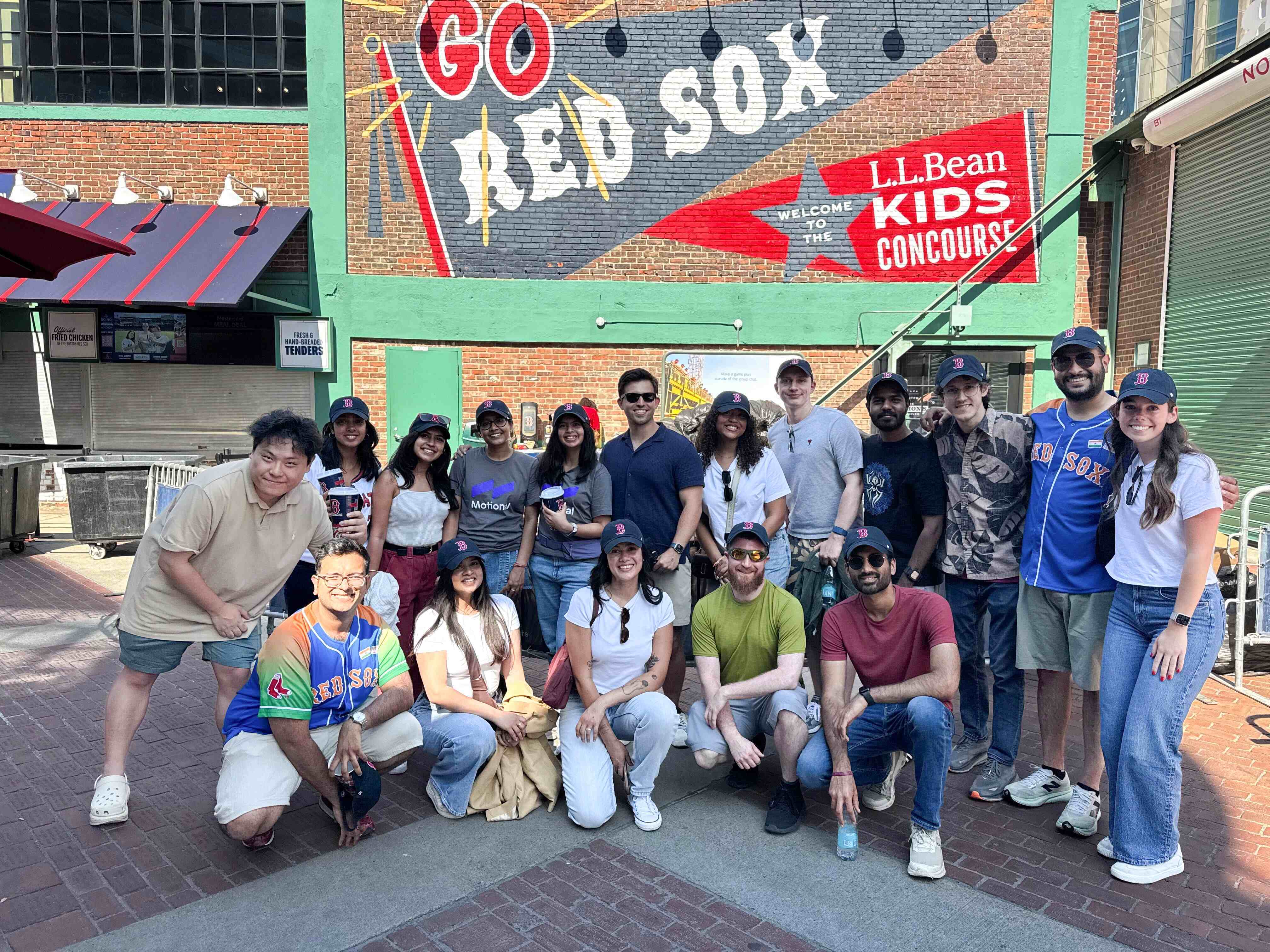 Boston team members at a Red Sox game